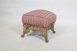 A C19th gilt brass footstool, with pierced frieze and scrolled supports, 14" x 14" x 14"
