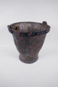 A C19th leather fire bucket, 11" high, A/F