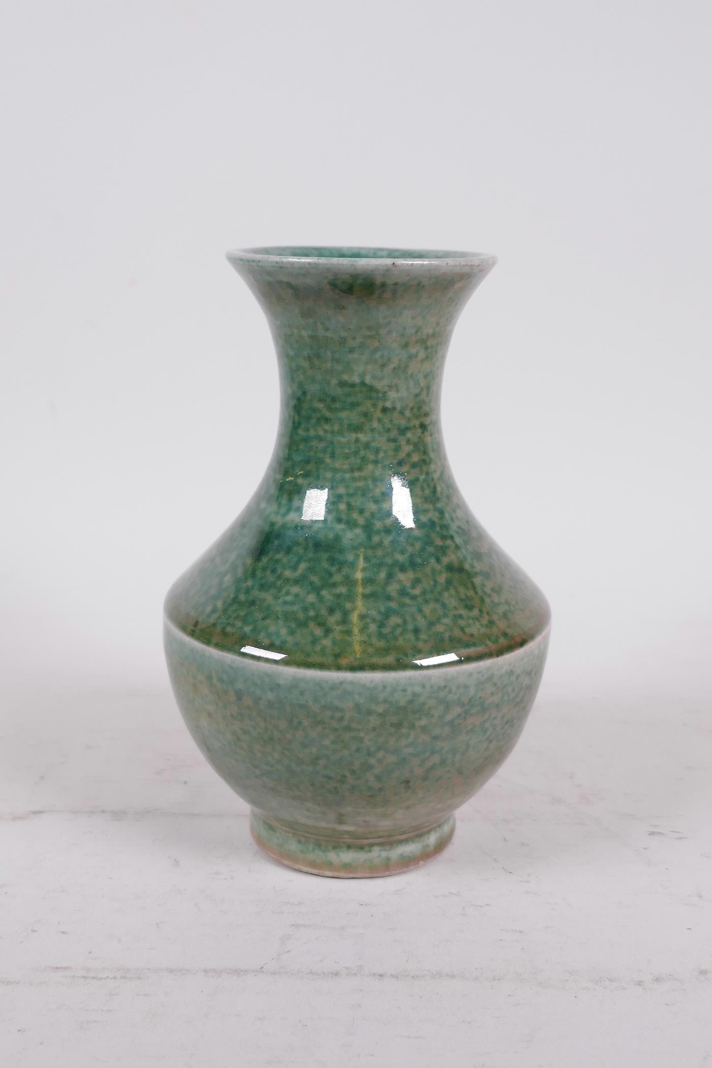 A Chinese mottled green glazed pottery vase, 6" high