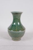 A Chinese mottled green glazed pottery vase, 6" high