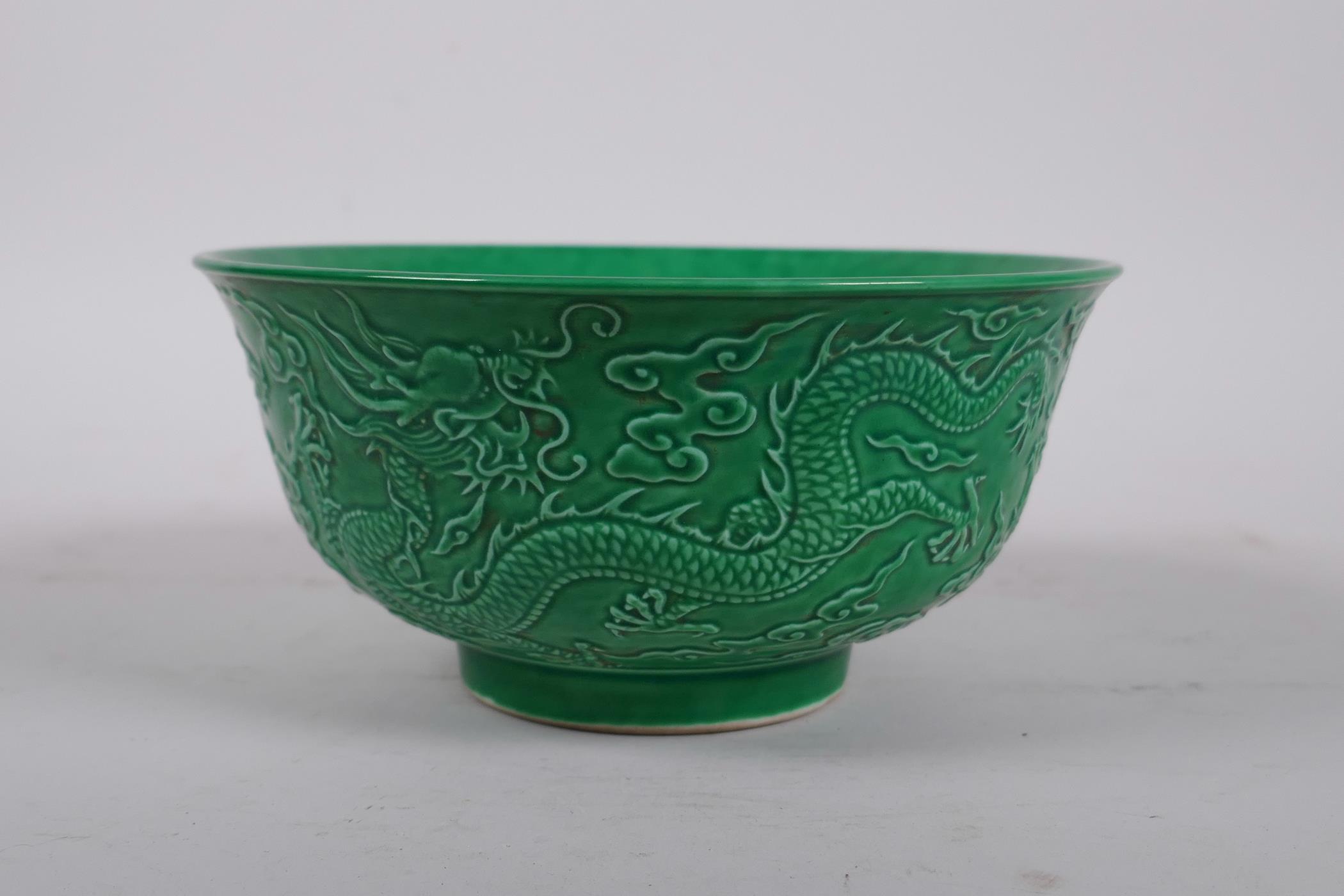 A Chinese green glazed porcelain rice bowl with raised dragon decoration, 6 character mark to - Image 3 of 4