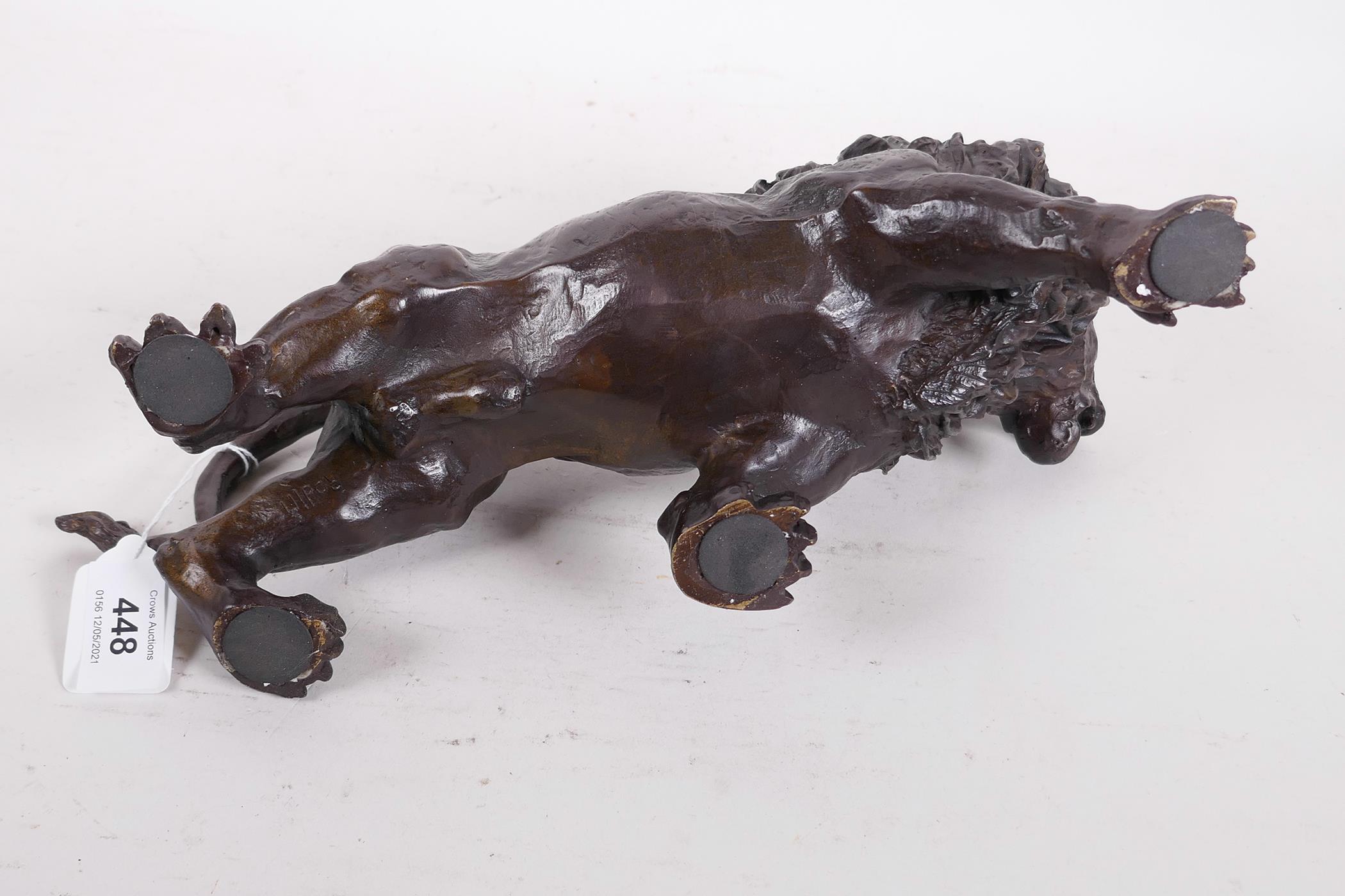 A hollow cast patinated brass figure of a lion, 12" long - Image 6 of 6