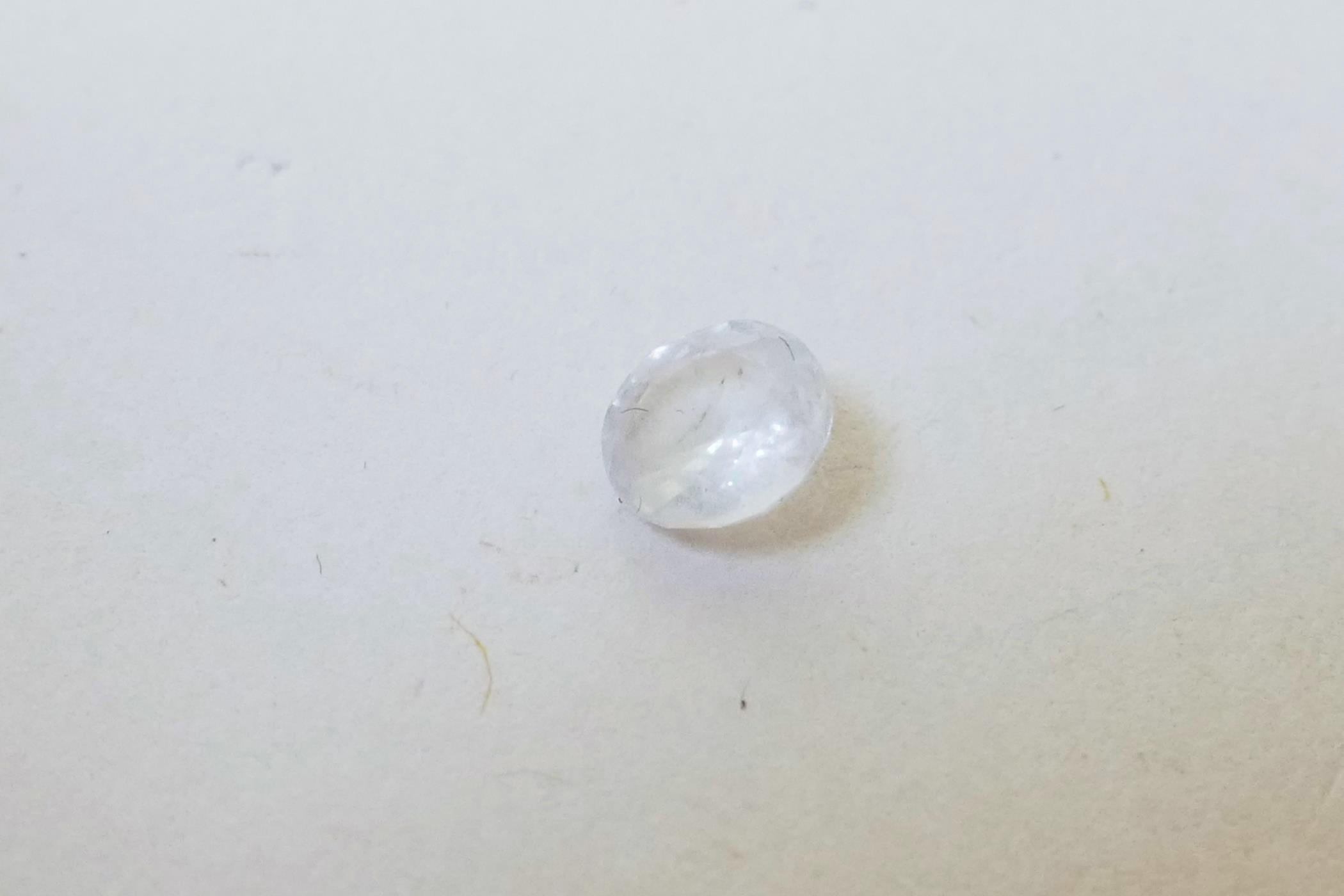 A 0.62ct white sapphire, round mixed cut, IDT certified, with certificate