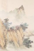 A Chinese watercolour on silk depicting a mountain landscape with a hidden dwelling, signed and seal