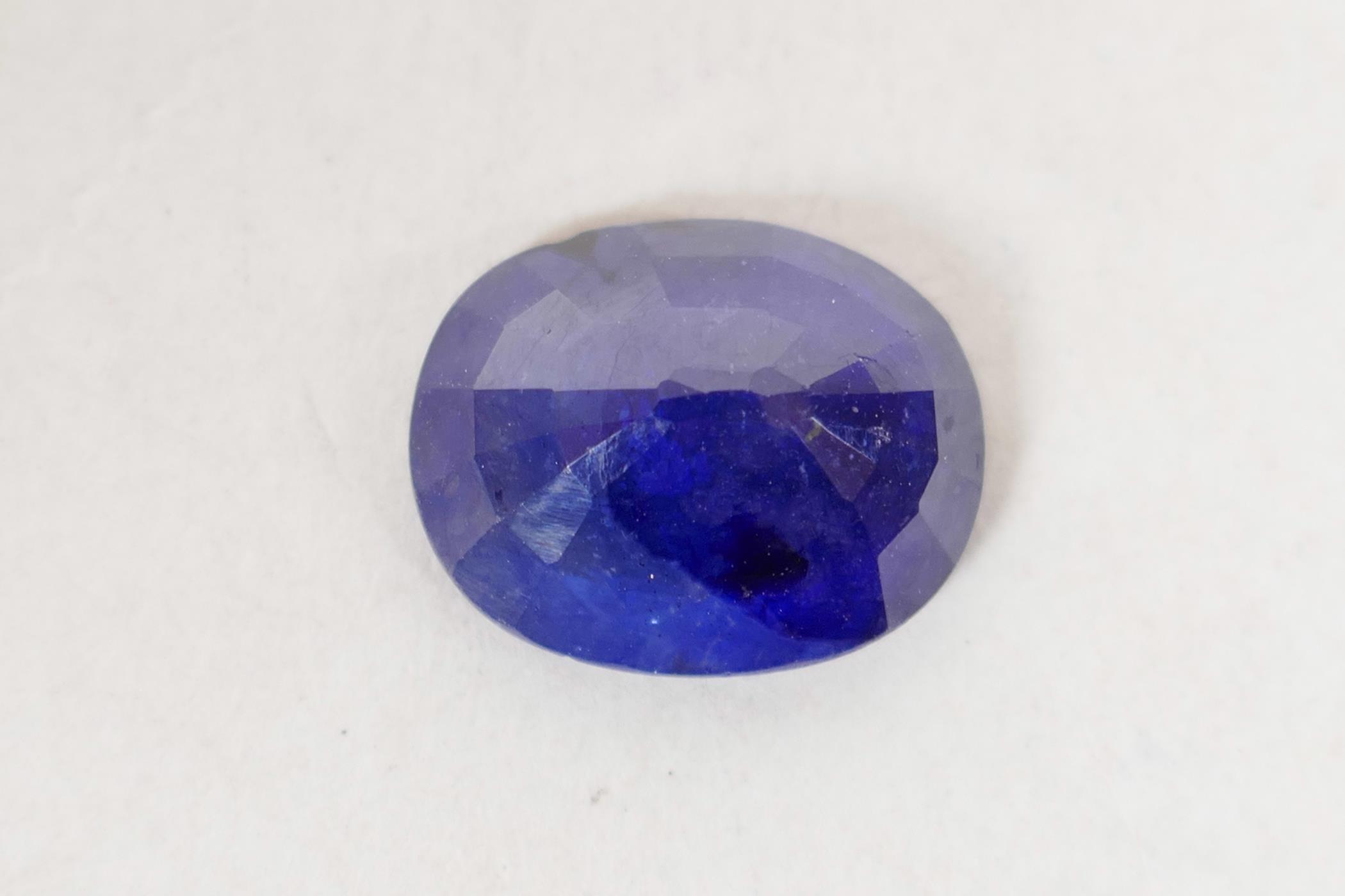 An 8.10ct blue sapphire, oval mixed cut, IDT certified, with ceritificate - Image 4 of 5