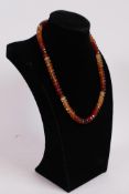 A 333ct hessonite garnet gemstone necklace, gilt clasp, length 18"
