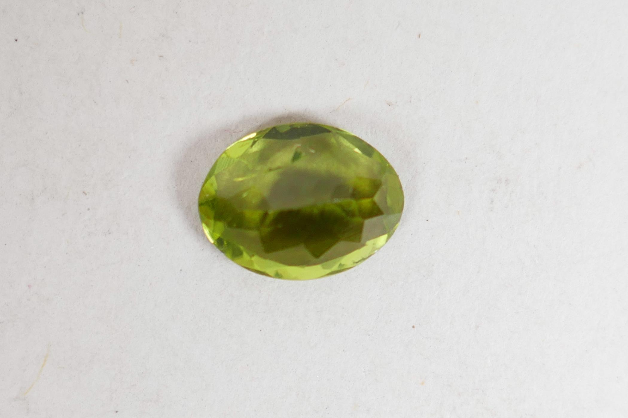 A 1.99ct peridot, oval mixed cut, ITLGR certified, with certificate - Image 6 of 8