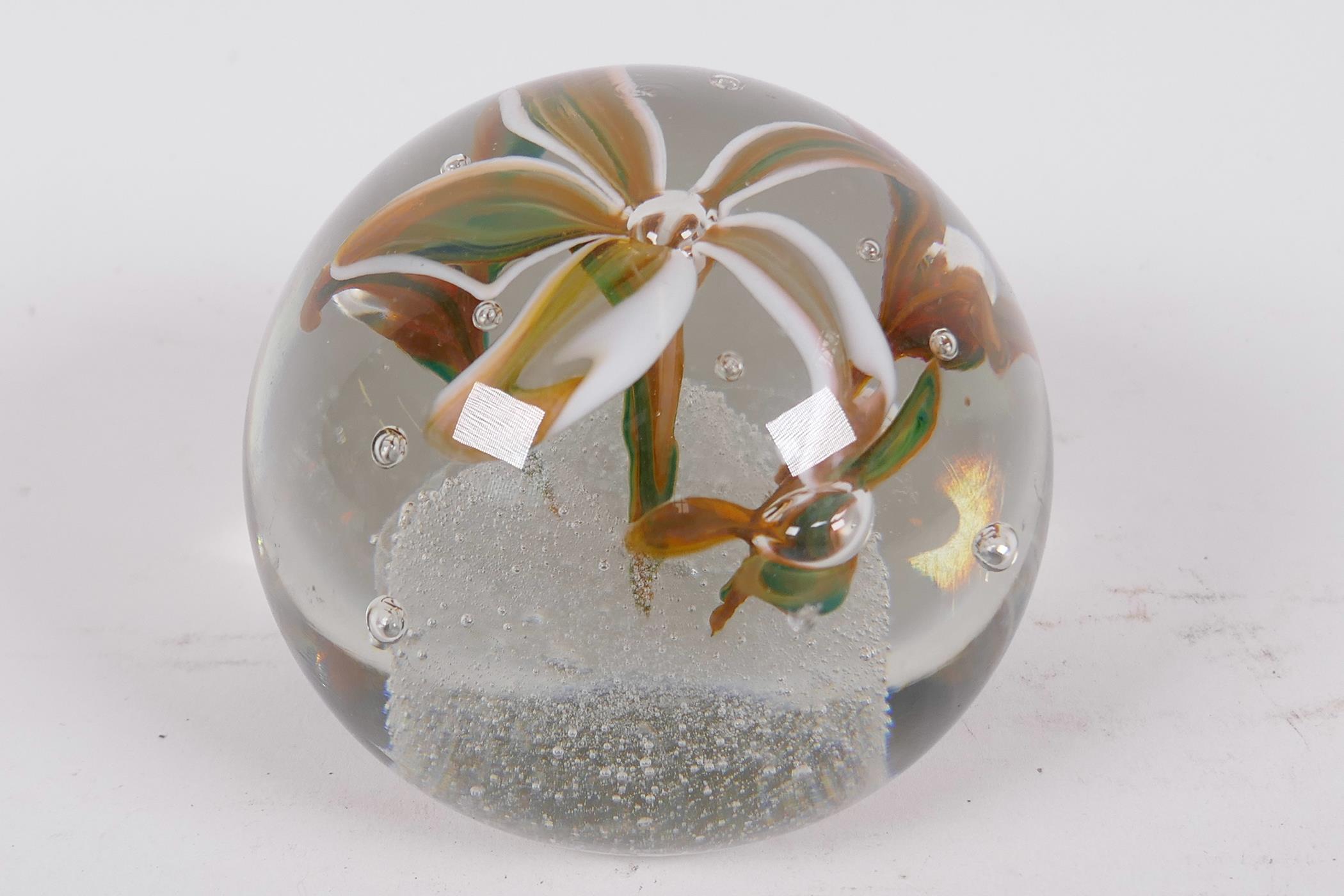 A heavy glass paperweight decorated with lilies, 3½" diameter - Image 2 of 3