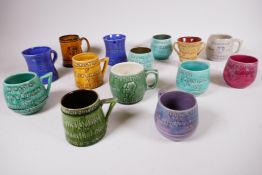 A collection of thirteen 1937 coronation commemorative hand thrown pottery mugs, barrel shaped