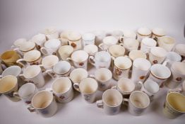 A large quantity of regional 1937 coronation commemorative porcelain and pottery mugs, beakers etc