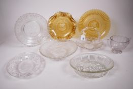 A collection of eight 1937 commemorative coronation pressed glass vessels in both clear and amber