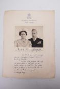 A signed 1948 portrait of King George VI and Queen Elizabeth with Royal cypher in silver above