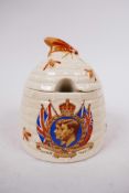 A 1937 coronation commemorative Clarice Cliff designed honey pot with cover