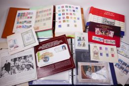 A large collection of British and Commonwealth postage stamps, mint and unused in albums