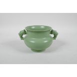 A Chinese green glazed porcelain two handled censer, raised character inscription to base, 4½"