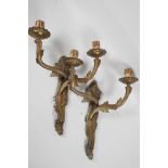 A pair of brass Art Nouveau leaf form two light wall sconces, 13" high