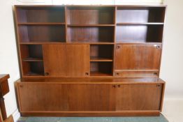 A mid century Danish rosewood side cabinet in two sections, probably Mobler, Danish furniture