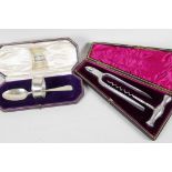 A hallmarked silver christening spoon and napkin ring set in a presentation box from Harrods,