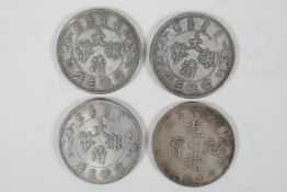 Four Chinese facsimile white metal coins/token, 1½" diameter