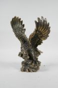 An Oriental filled bronze of an eagle, impressed mark to base, 8" high