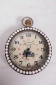 A replica top wind pocket watch set with a ring of pearl beads front and back, the back decorated
