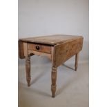 A C19th pine drop leaf table, with single end drawer, raised on turned supports, 47" x 21" x 30"