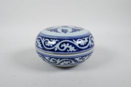 A Chinese blue and white porcelain circular box and cover with auspicious symbol decoration, 6