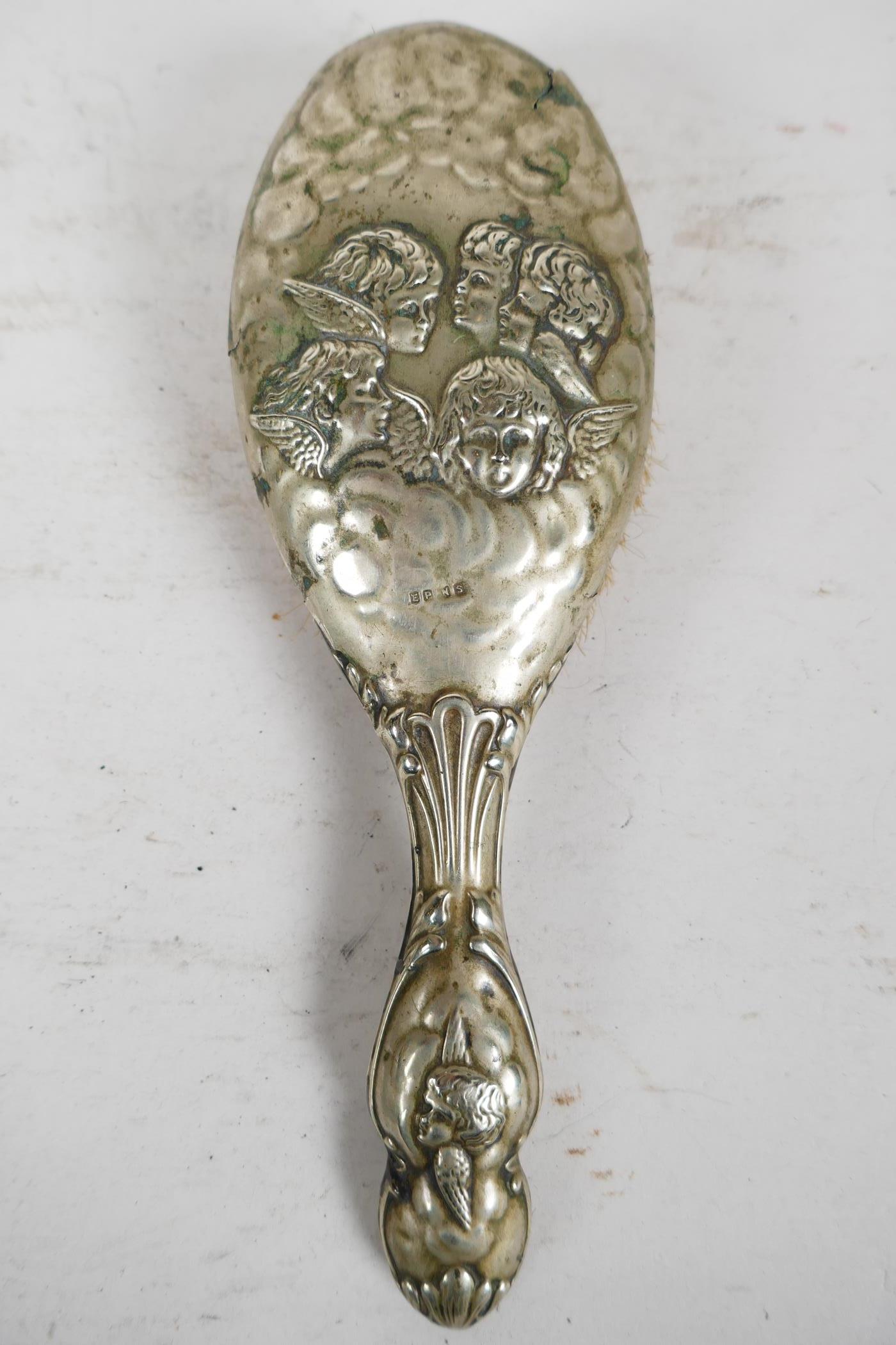 A silver backed late C19th mirror and brush dressing table set, with repousse scrolls, birds and - Image 5 of 7