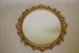 A late C19th Florentine style giltwood framed wall mirror, with carved and pierced frame, 27"