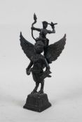 A Tibetan bronze of a figure riding the Garuda, 7½" high
