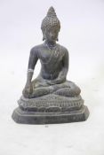 A C19th Siamese bronze Buddha, seated upon a lotus throne and inscribed to the base, 8" high