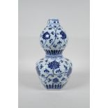 A Chinese Ming style blue and white porcelain double gourd vase with scrolling lotus flower