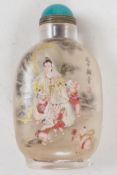 A Peking glass snuff bottle with interior decoration depicting a lady with five children, the