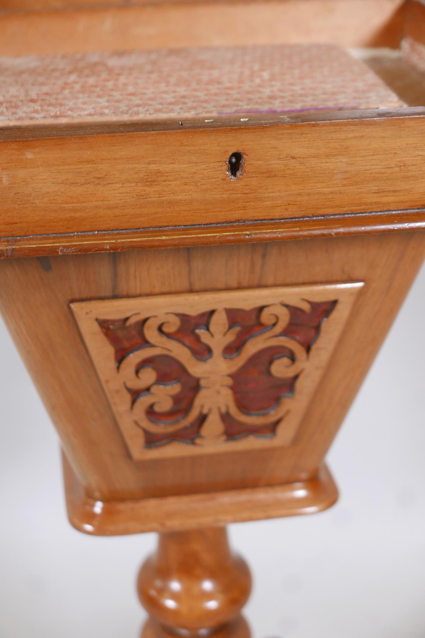 A Victorian walnut workbox with lift up top and pierced basket, raised on a turned column and carved - Image 5 of 5