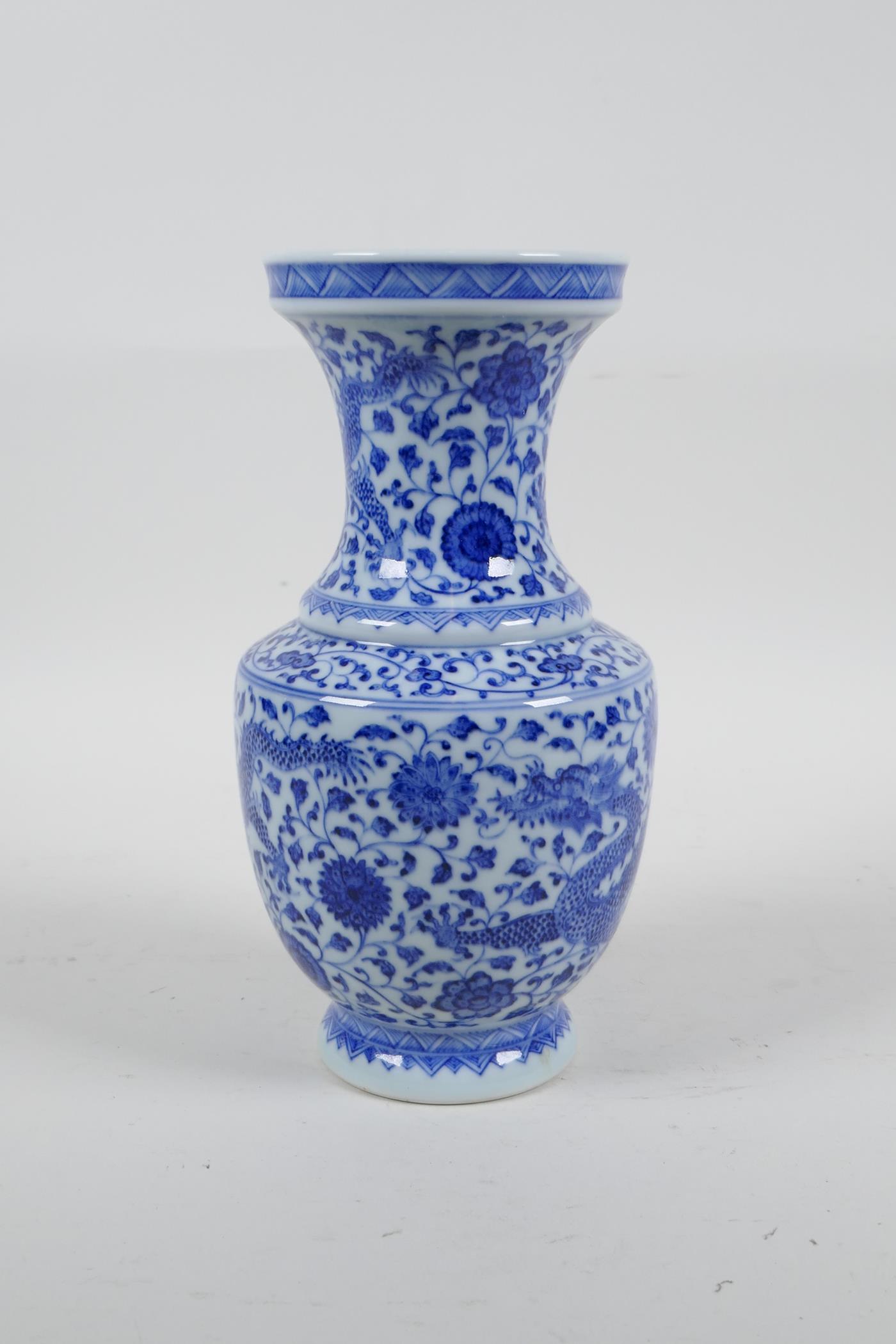 A Chinese blue and white porcelain vase with dragon and lotus flower decoration, seal mark to - Image 4 of 5