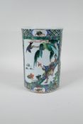 A Chinese famille verte porcelain brush pot decorated with landscape scenes with kylin and birds,