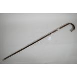 An antique walking cane with silver mounts, 32" long