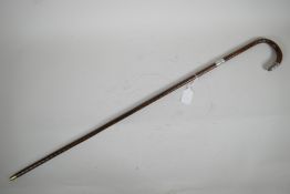 An antique walking cane with silver mounts, 32" long