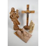 A Terracotta plaque depicting the Madonna and Child with gilt decoration, 10" x 6", together with