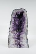 An amethyst geode, 13½" high x 17½" wide