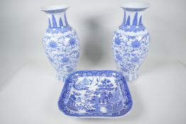 A pair of Chinese blue and white vases decorated with stylised flowers, 12" high, together with a