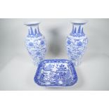 A pair of Chinese blue and white vases decorated with stylised flowers, 12" high, together with a