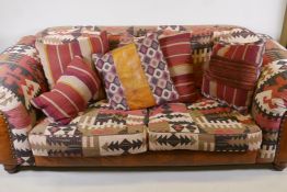 A two seater sofa and matching armchair, with kelim style upholstery, and a quantity of associated