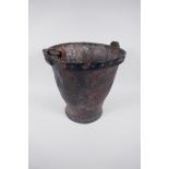 A C19th leather fire bucket, 11" high, A/F