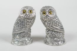 A pair of silver plated owl condiments, 2" high