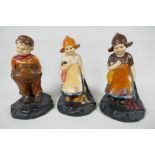 Three Bretby pottery figures of Dutch children, 7½" high