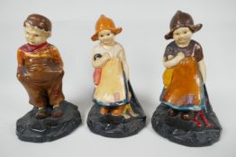 Three Bretby pottery figures of Dutch children, 7½" high