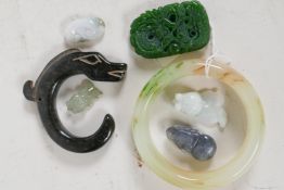 A collection of jade and hardstone ornaments including pendants, bangles etc