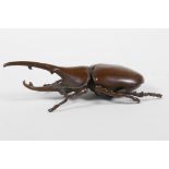 A Japanese Jizai style bronze long horn beetle, the carapace opening to reveal a box, 4½" long