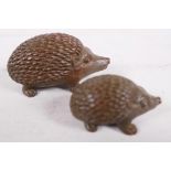 A pair of Japanese Jizai style figurines of hedgehogs, largest 2" long